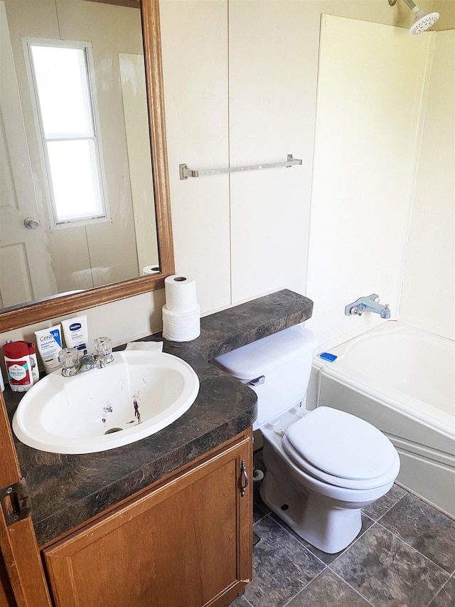 full bathroom with washtub / shower combination, toilet, and vanity