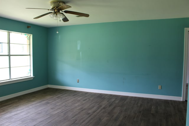619 Carolyn St, Winnie, TX 77665 - unfurnished room with dark wood-type flooring and a ceiling fan