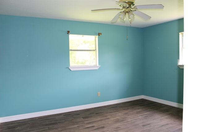 619 Carolyn St, Winnie, TX 77665 - spare room featuring dark wood-style flooring and a ceiling fan