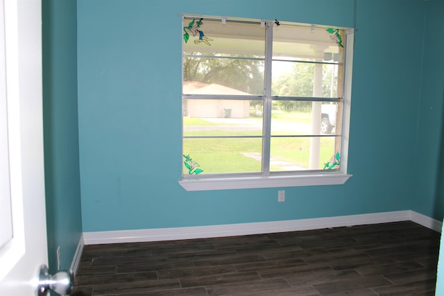 619 Carolyn St, Winnie, TX 77665 - empty room with dark wood-type flooring