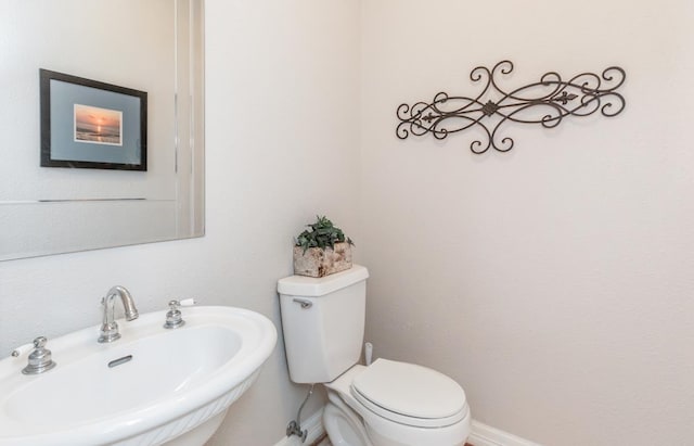 bathroom with sink and toilet