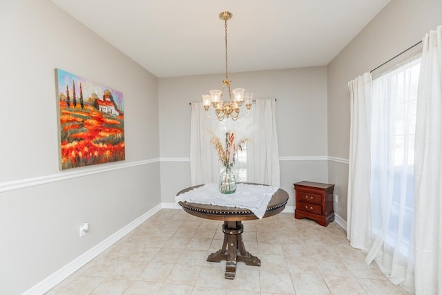 dining space with a wealth of natural light and a chandelier