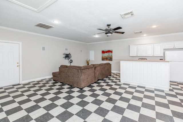 living room with ceiling fan and ornamental molding