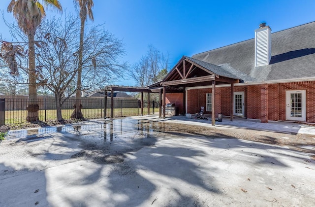 exterior space featuring a pergola and a patio