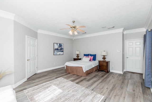 bedroom with ceiling fan, light wood-type flooring, and ornamental molding