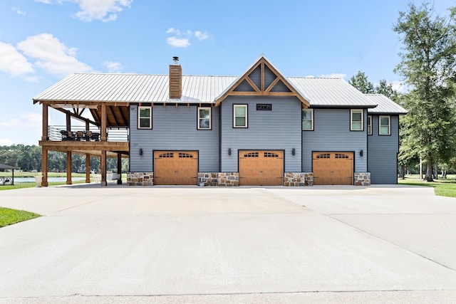 exterior space with a garage and a wooden deck