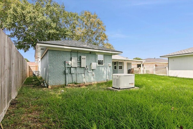 view of outdoor structure featuring a lawn