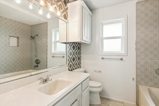 full bathroom with vanity, shower / bathtub combination, and toilet