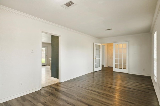 unfurnished room with french doors, dark hardwood / wood-style floors, and ornamental molding