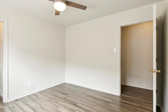 unfurnished room with light hardwood / wood-style flooring and ceiling fan