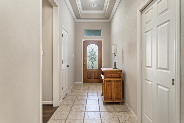 doorway featuring ornamental molding