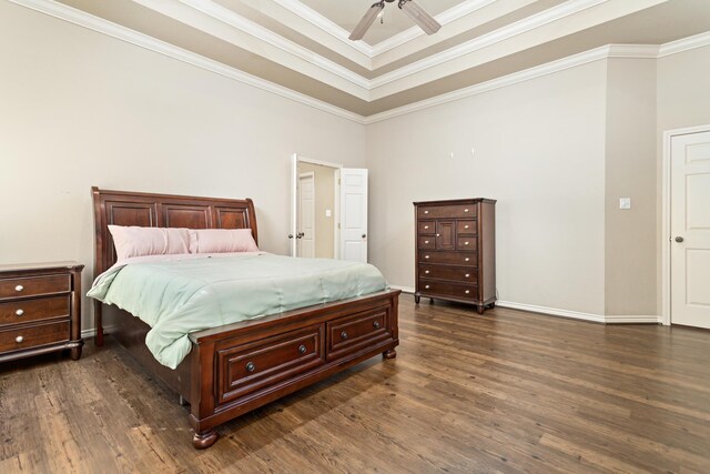 bedroom with dark hardwood / wood-style floors, ceiling fan, and crown molding