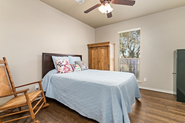 bedroom with dark hardwood / wood-style floors and ceiling fan