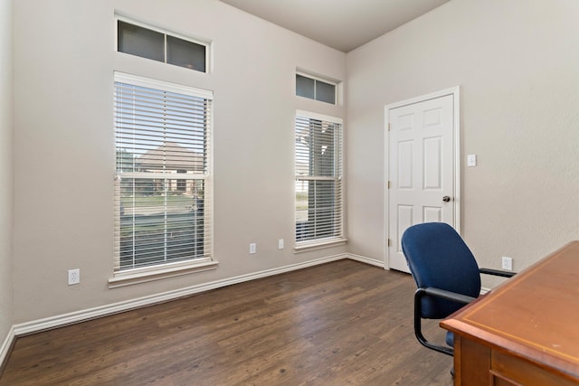 office with dark hardwood / wood-style flooring