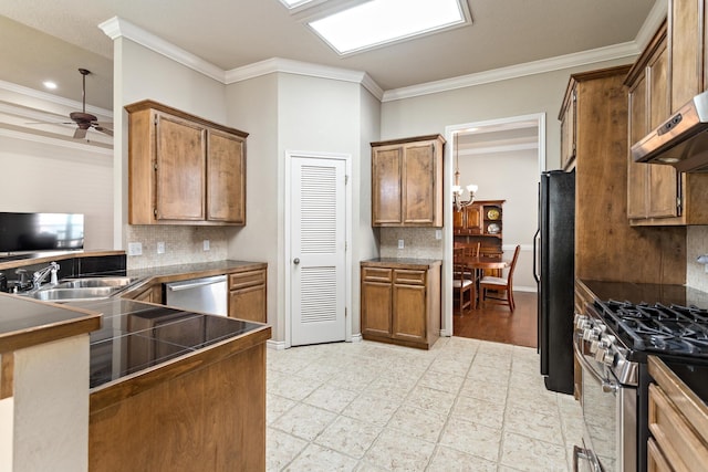 kitchen featuring decorative backsplash, ceiling fan, ornamental molding, and appliances with stainless steel finishes