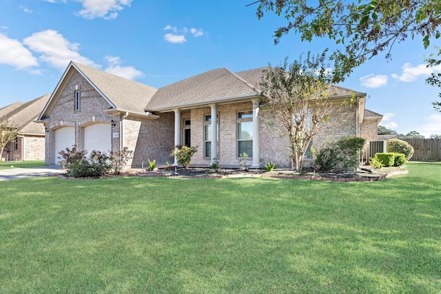 view of front facade with a garage and a front lawn