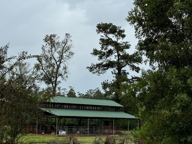 view of home's community featuring an outbuilding