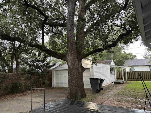 4609 Alamosa St, Port Arthur, TX 77642 - wooden deck with an outbuilding and a garage
