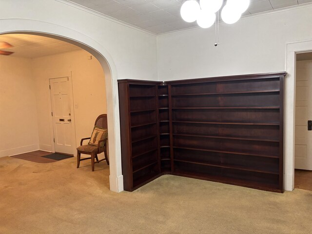 4609 Alamosa St, Port Arthur, TX 77642 - unfurnished room featuring arched walkways, carpet, and ornamental molding