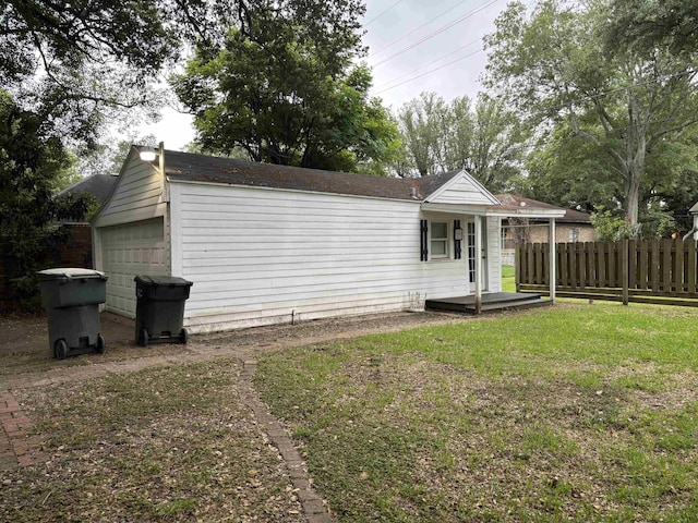 4609 Alamosa St, Port Arthur, TX 77642 - rear view of property with a garage