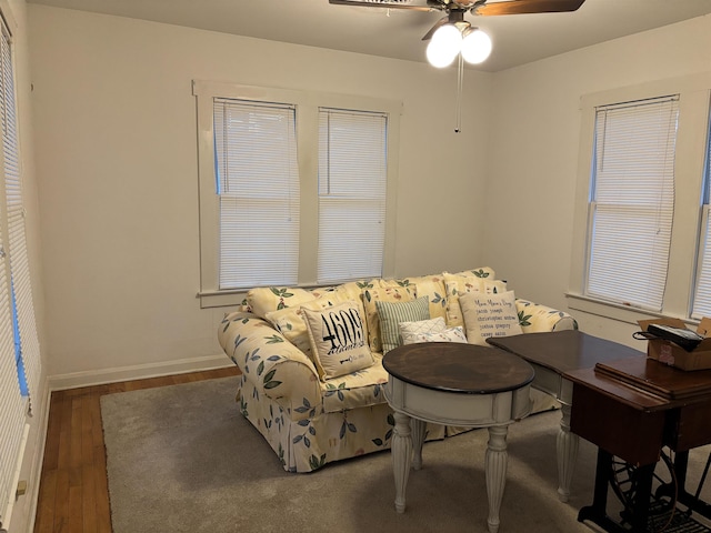 4609 Alamosa St, Port Arthur, TX 77642 - living area featuring wood finished floors, a ceiling fan, and baseboards