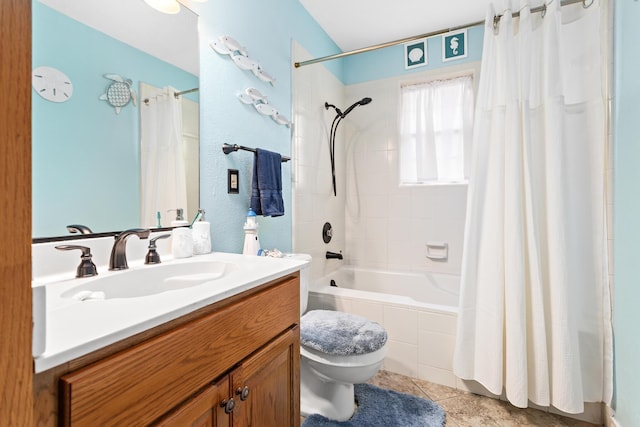 full bathroom featuring tile patterned floors, vanity, shower / tub combo, and toilet