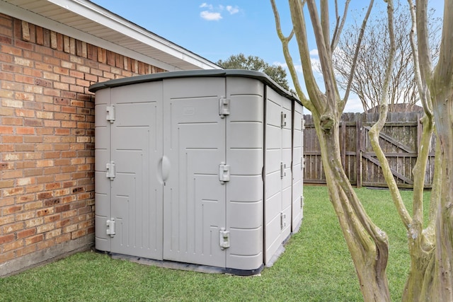 view of outdoor structure featuring a lawn