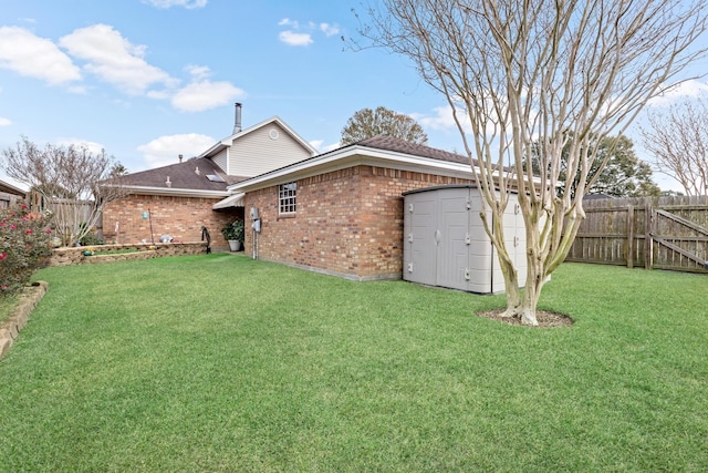 back of property with a lawn and a garage