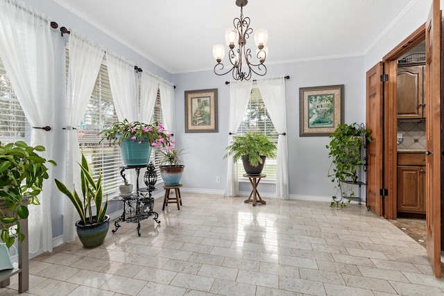 dining room with an inviting chandelier and crown molding