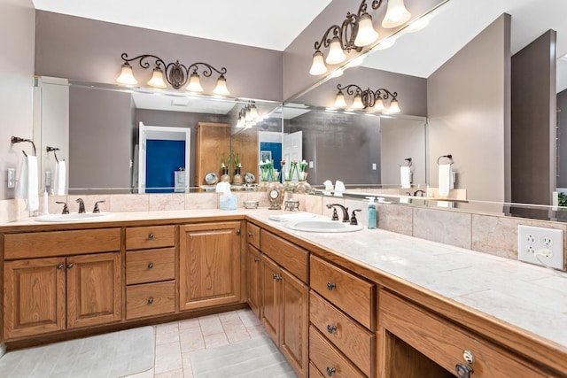 bathroom featuring tile patterned flooring and vanity