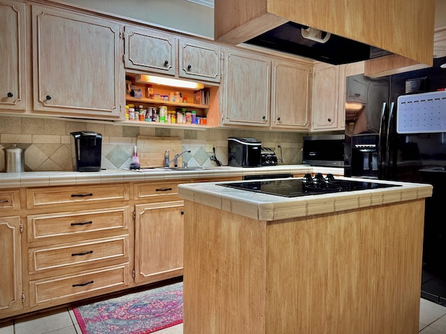 kitchen featuring tile counters, a kitchen island, light tile patterned floors, and tasteful backsplash