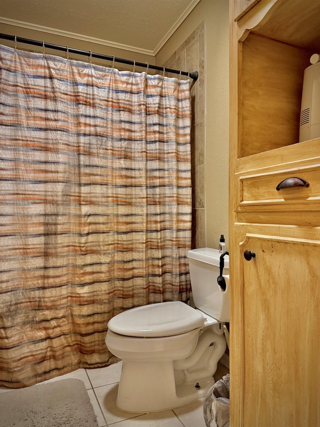 bathroom with tile patterned flooring, a textured ceiling, and toilet