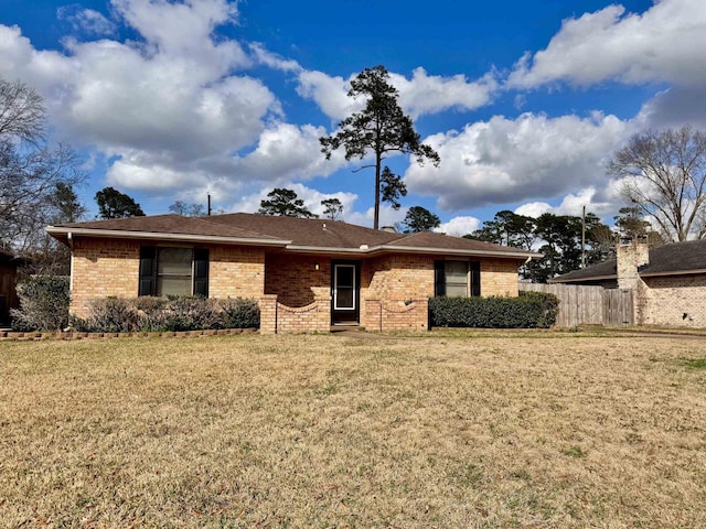 ranch-style house with a front lawn