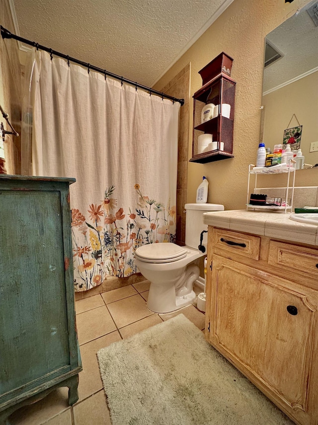 bathroom with tile patterned floors, a shower with curtain, crown molding, toilet, and a textured ceiling