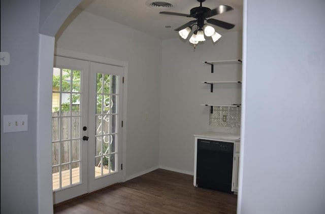 doorway featuring french doors, ceiling fan, and dark wood-type flooring