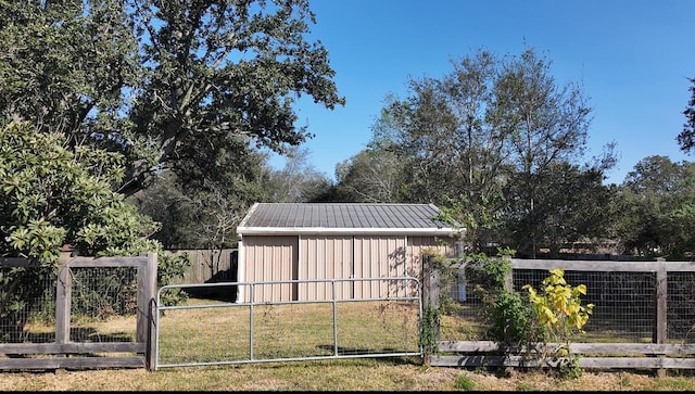 view of outbuilding with a yard