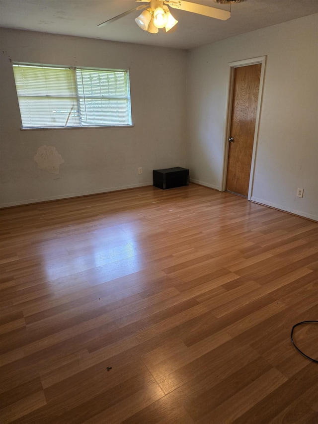1610 Cartwright Ave, Beaumont, TX 77701 - spare room with wood finished floors, ceiling fan, and baseboards