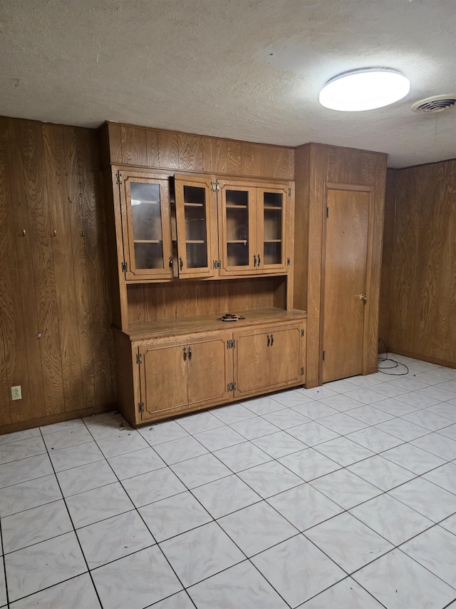 1610 Cartwright Ave, Beaumont, TX 77701 - unfurnished room with wooden walls and a textured ceiling