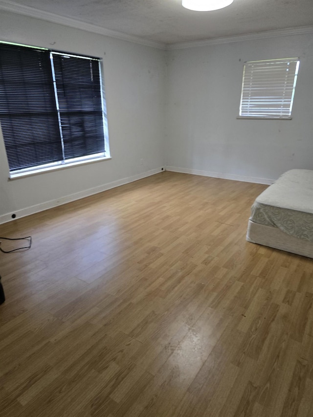 1610 Cartwright Ave, Beaumont, TX 77701 - unfurnished room featuring crown molding, wood finished floors, and baseboards