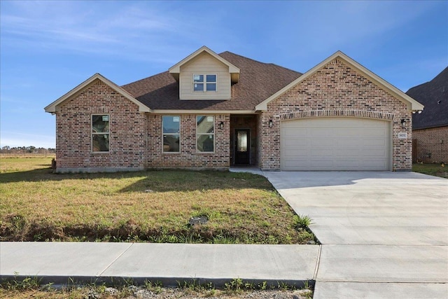 view of front of house featuring a front lawn and a garage