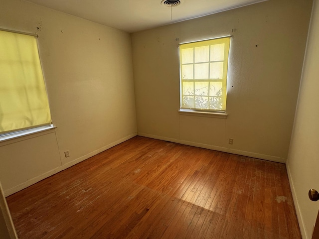 spare room with light hardwood / wood-style floors