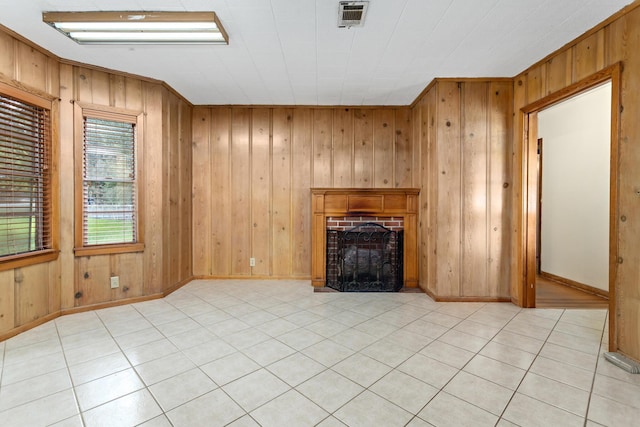 3785 Stanley Dr, Vidor, TX 77662 - unfurnished living room featuring a brick fireplace, wooden walls, and light tile patterned floors