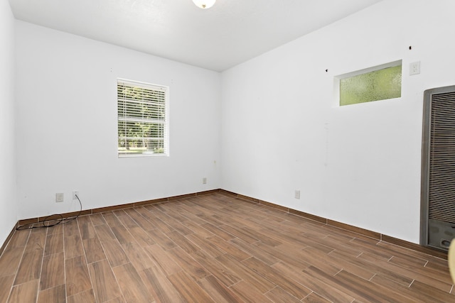 3785 Stanley Dr, Vidor, TX 77662 - unfurnished room with wood finished floors and a heating unit