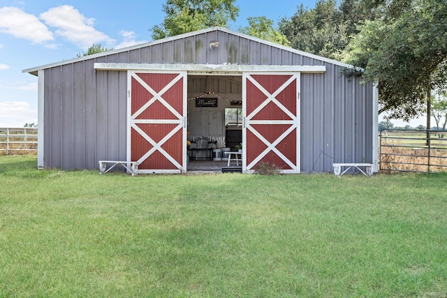 view of outbuilding with a lawn