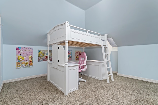 carpeted bedroom featuring vaulted ceiling