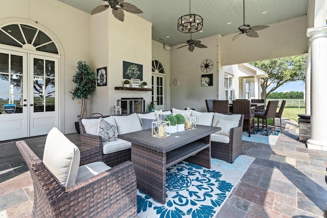 view of patio with ceiling fan, an outdoor hangout area, and french doors