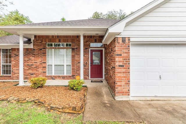 property entrance with a garage