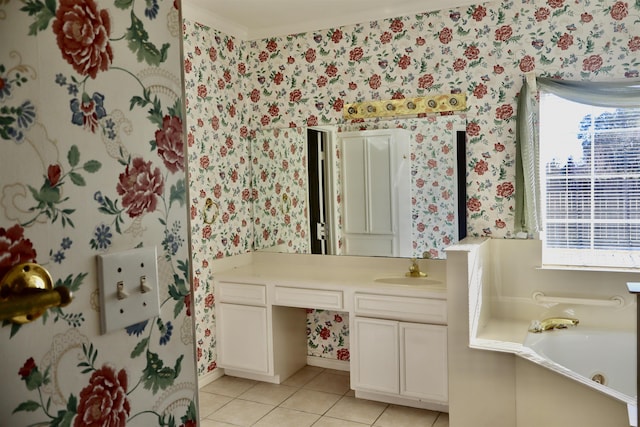 bathroom featuring tile patterned flooring, vanity, a tub, and a healthy amount of sunlight