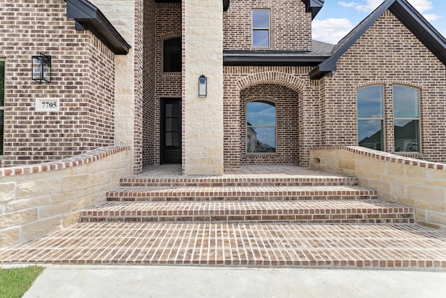 7705 Water Edge, Beaumont, TX 77707 - property entrance featuring brick siding