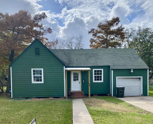 single story home featuring a garage and a front lawn